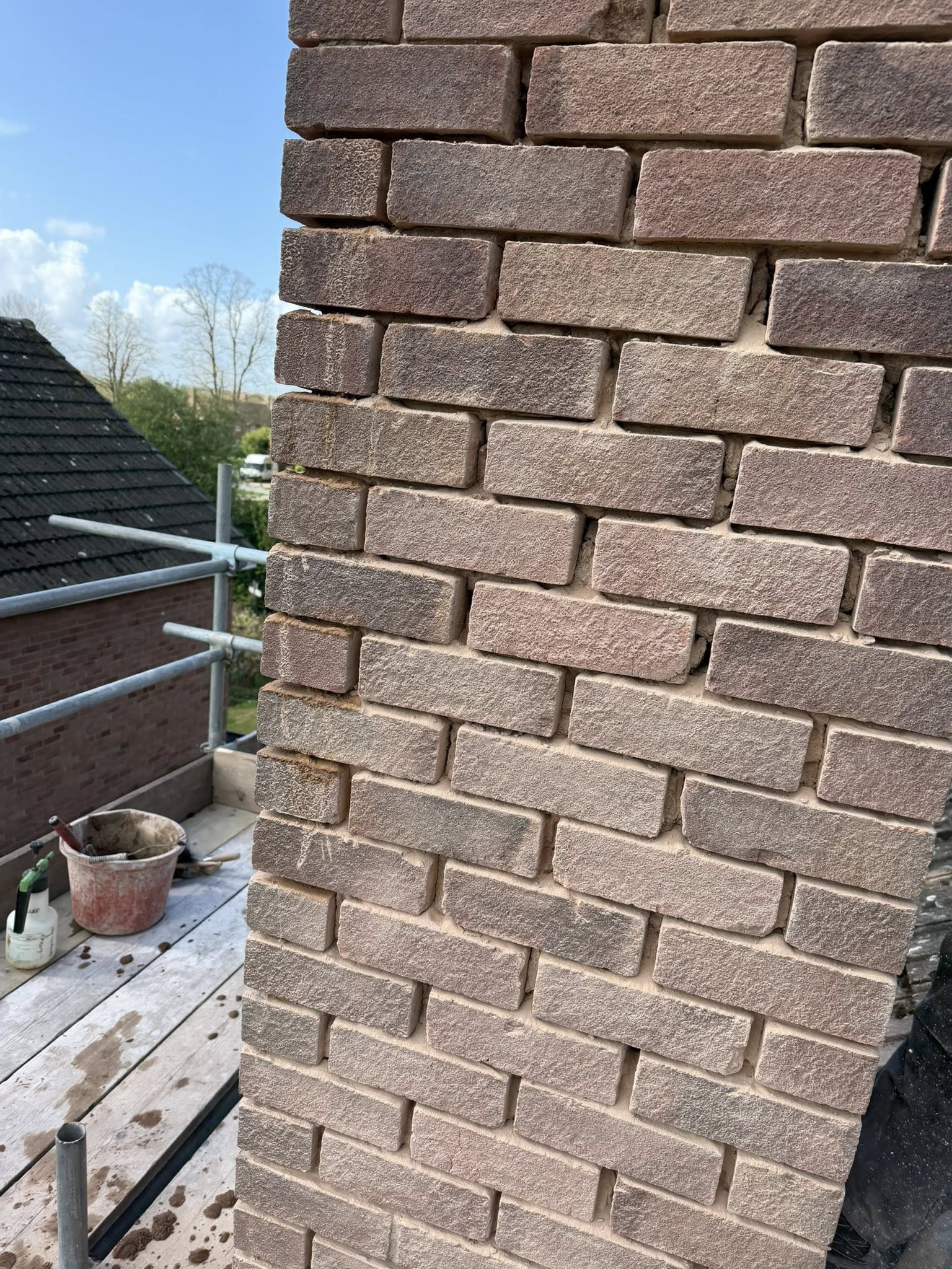 Close-up of crisp pointing on a freshly built chimney